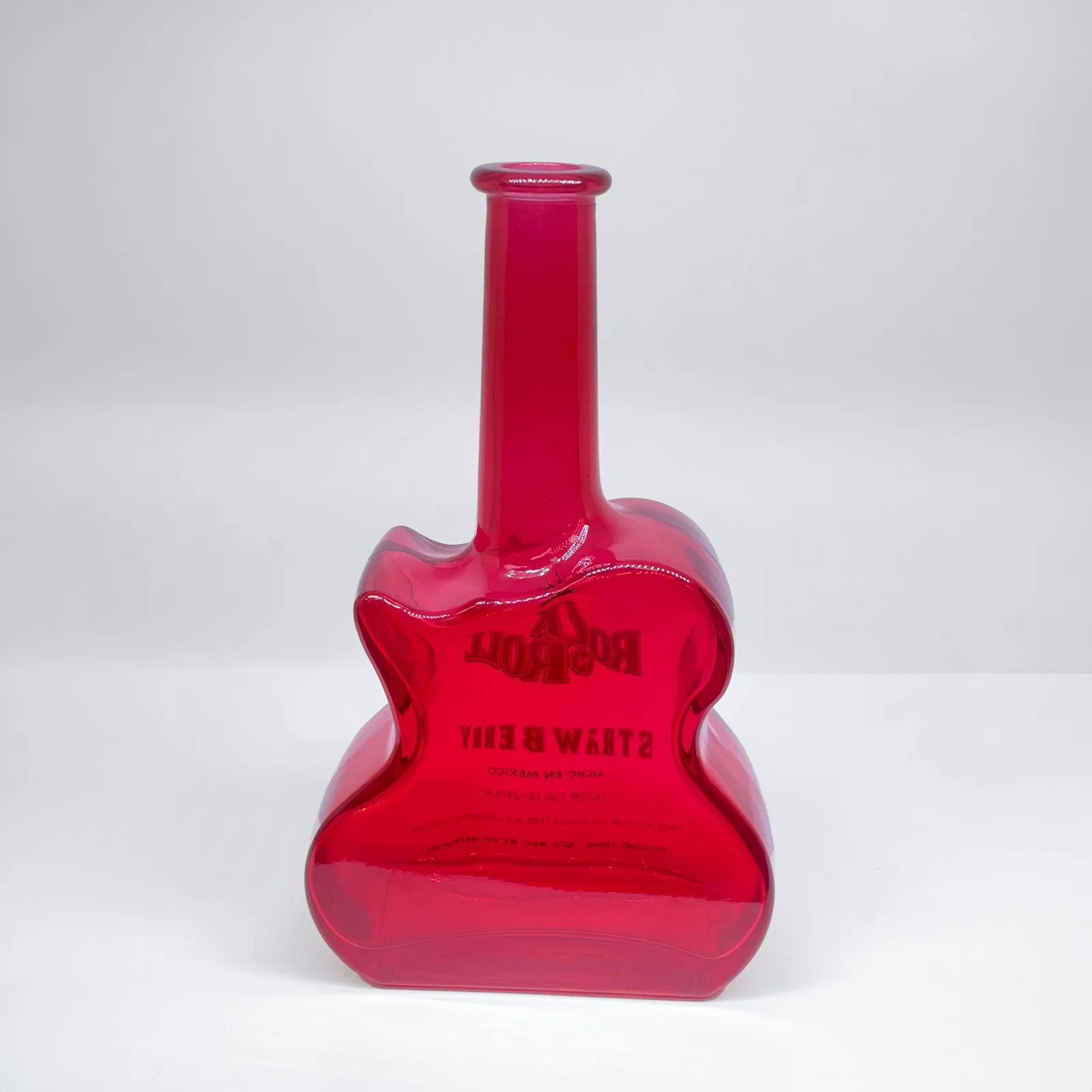 A special custom-shape drinks bottle in coloured glass. We can create any shape and any colour!